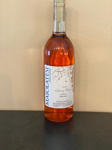 A bottle of maiolatesi wine is sitting on a table