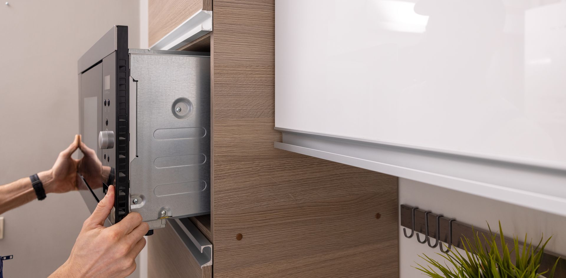 Integrated microwave oven installation in the domestic kitchen. Integrated microwave oven installation in the domestic kitchen.