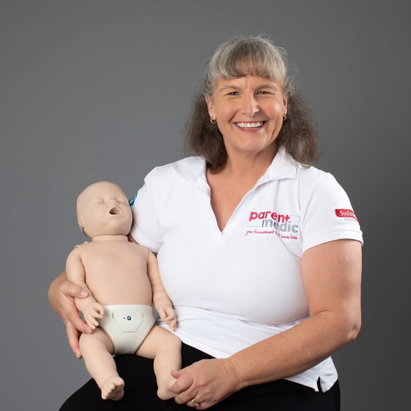 Loretta Woodford with baby manikin