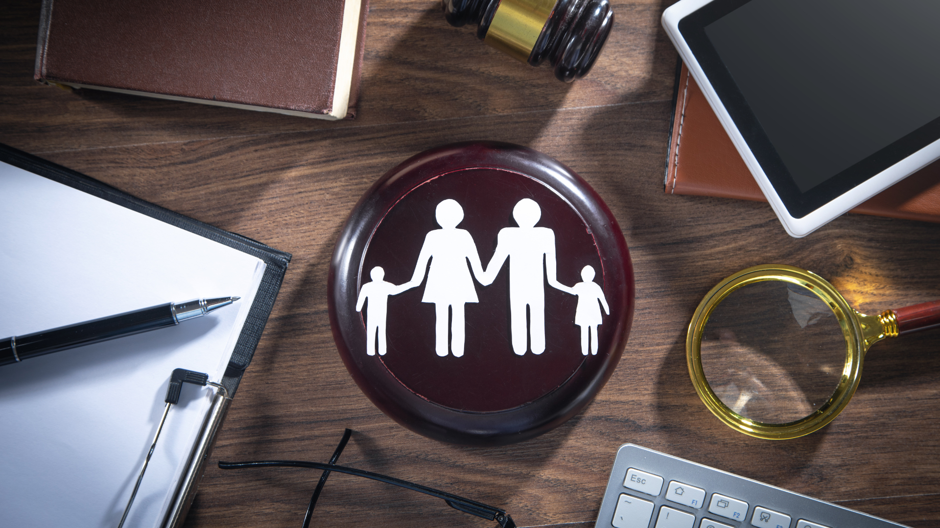 A wooden table with a family icon on it.