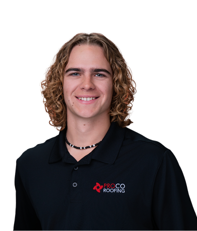 Portrait of a smiling person with curly hair wearing a black polo shirt with a company logo on a white background