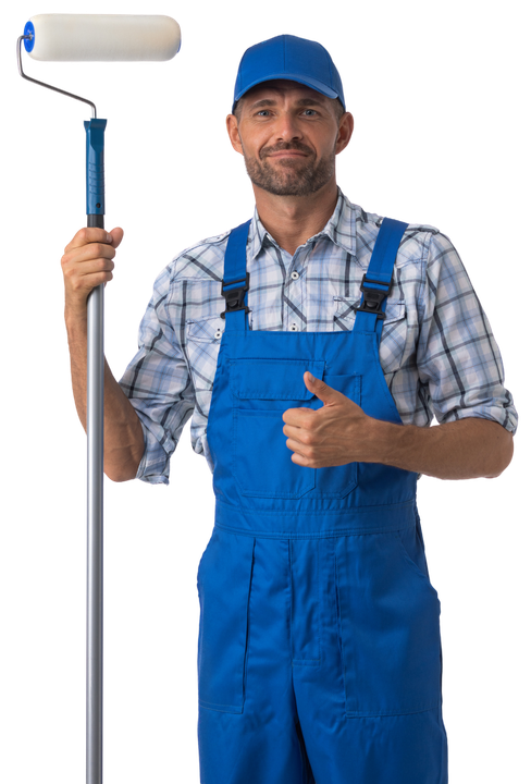 A plumber in green coveralls kneels on a bathroom floor, repairing a white toilet with tools nearby.