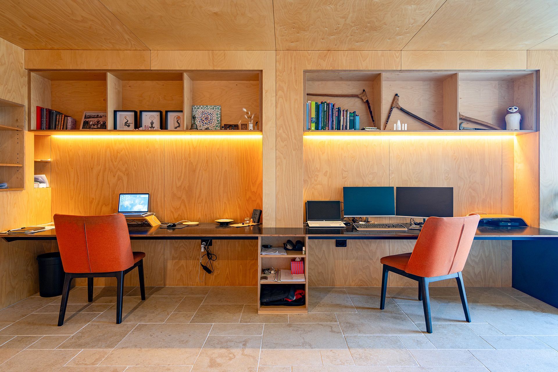 A home office with two desks and two chairs