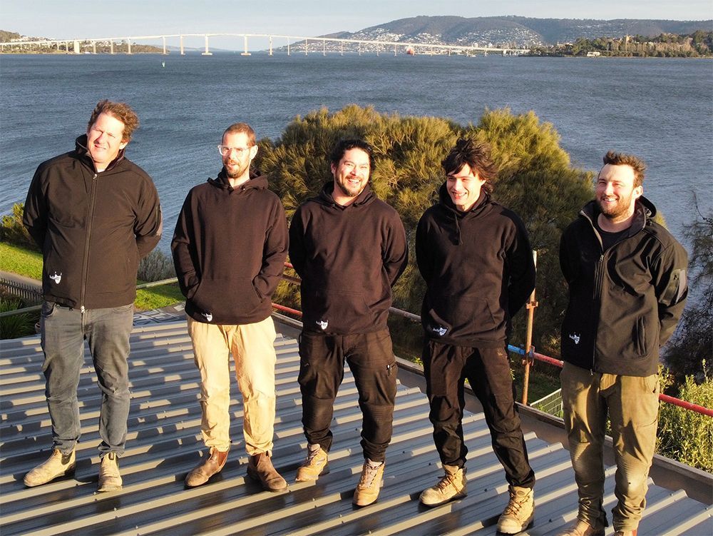 Photo of the Build 42 team with the Tasman Bridge in the background
