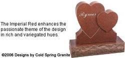 Heart-shaped red granite memorial with engraved rose and text about rich, varied hues