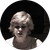 A portrait of a person with light hair looking downward in soft, dark lighting.