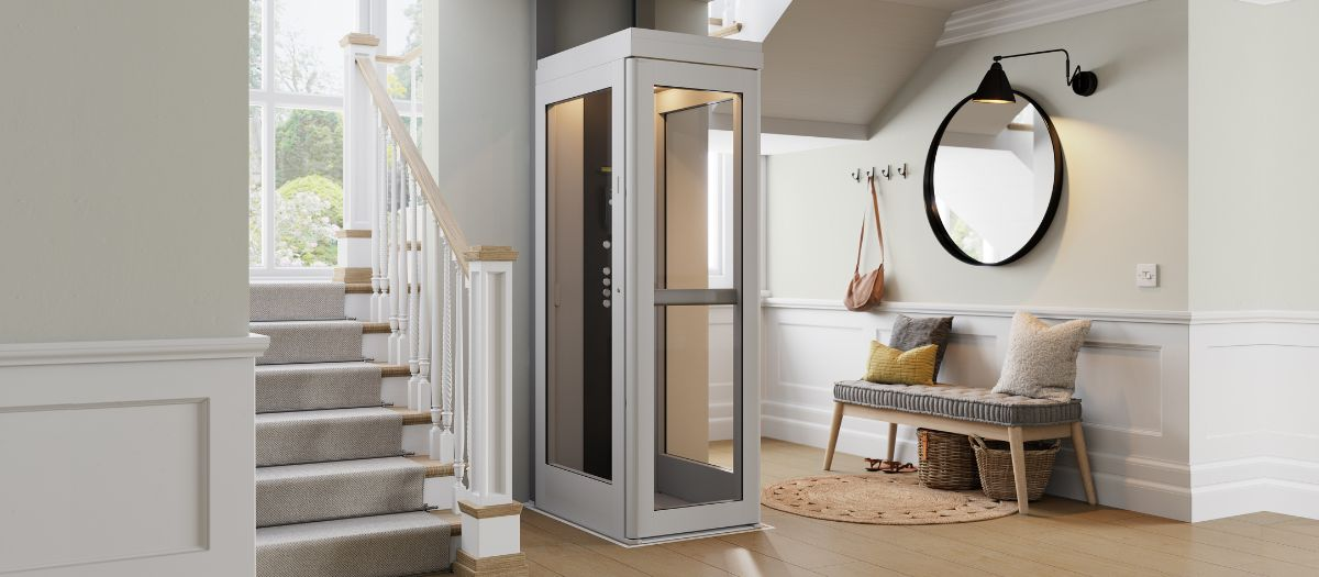 Residential porch wheelchair lift with gray platform and white railings beside wooden steps