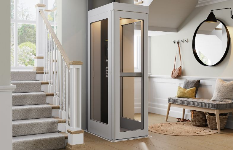 Residential porch wheelchair lift with gray platform and white railings beside wooden steps
