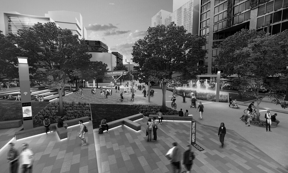A black and white photo of people walking in a park.