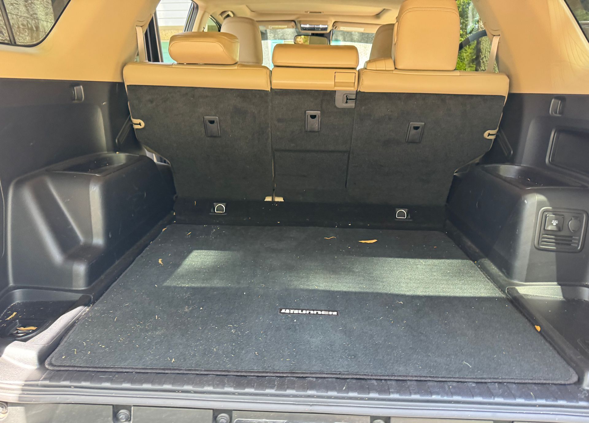 The back of a toyota 4runner with the trunk open