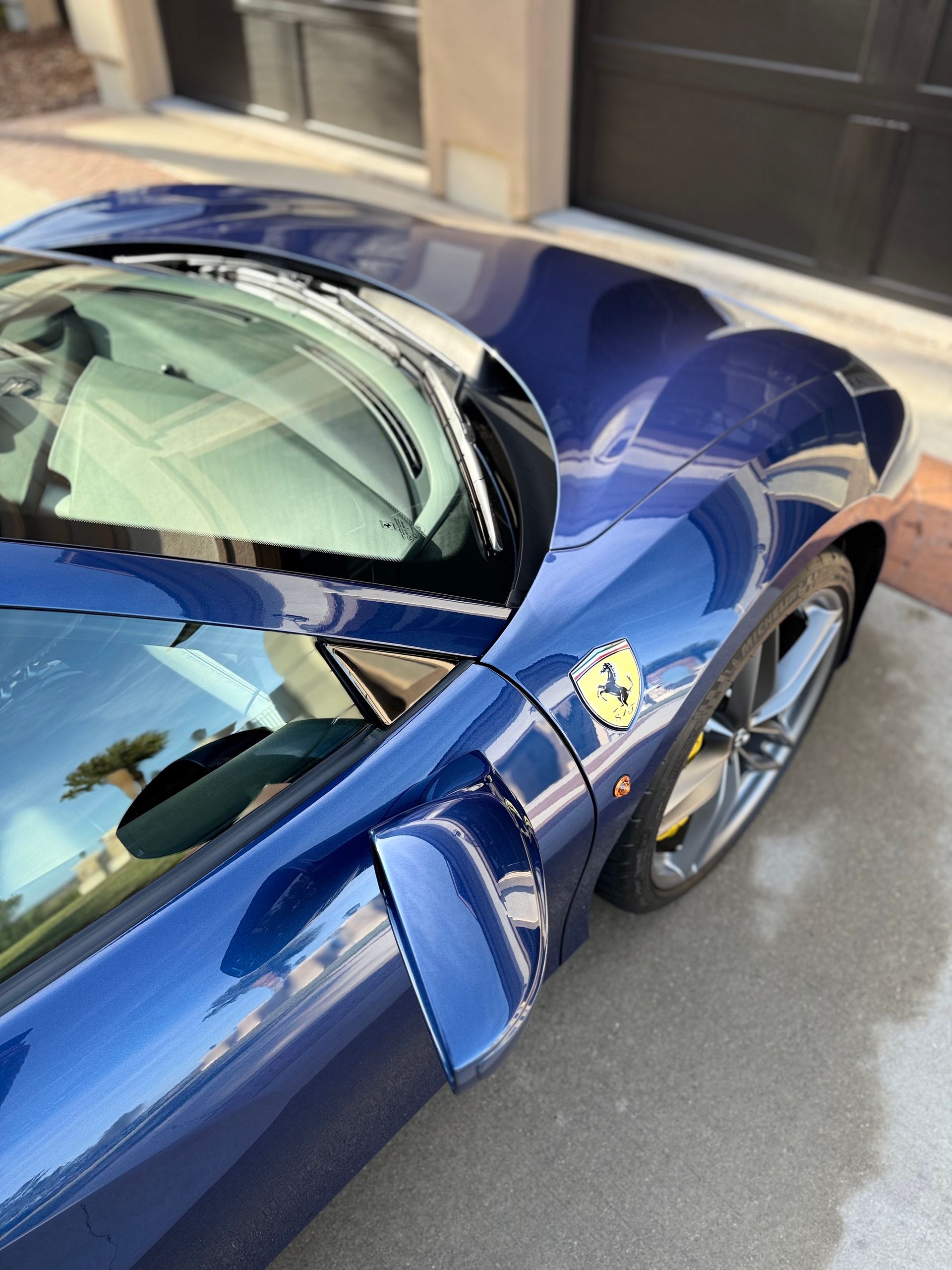 A close up of a car 's side in a garage