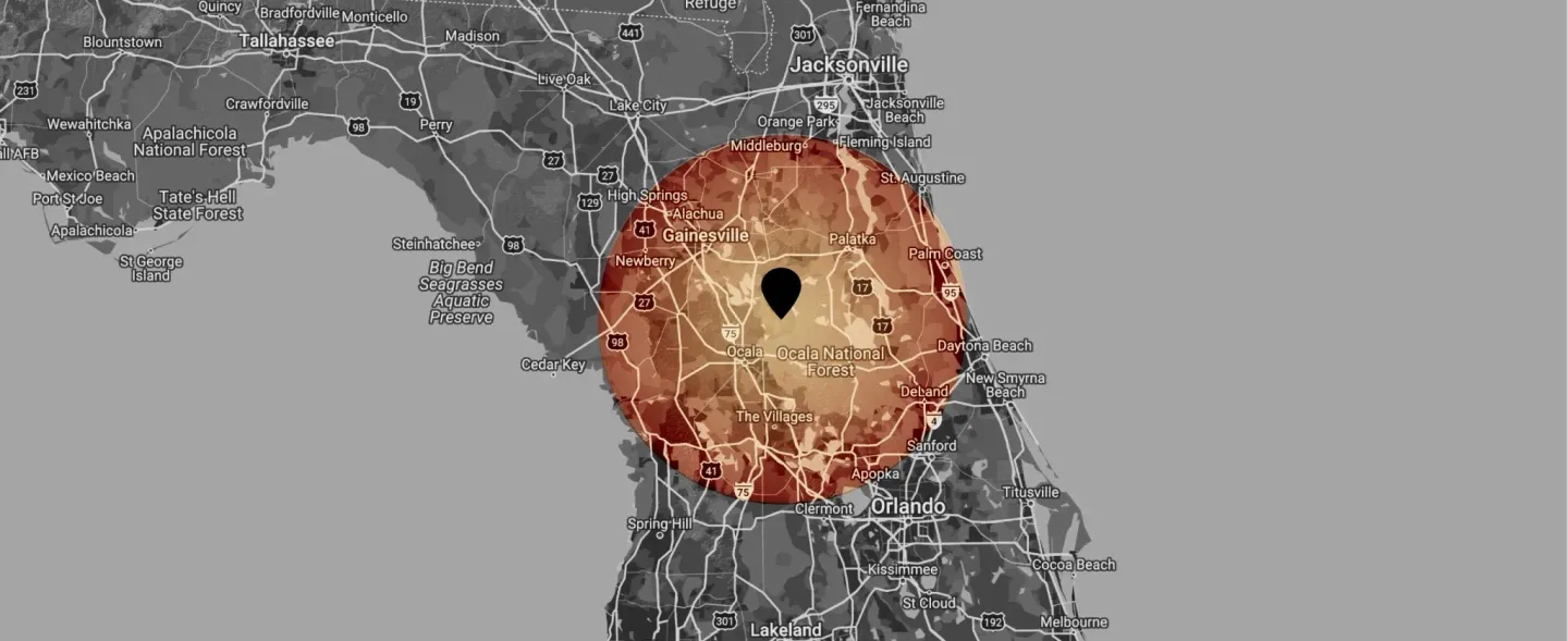 Map with a red-orange circular area in Florida, indicating a potential impact zone. Black dot in the center.