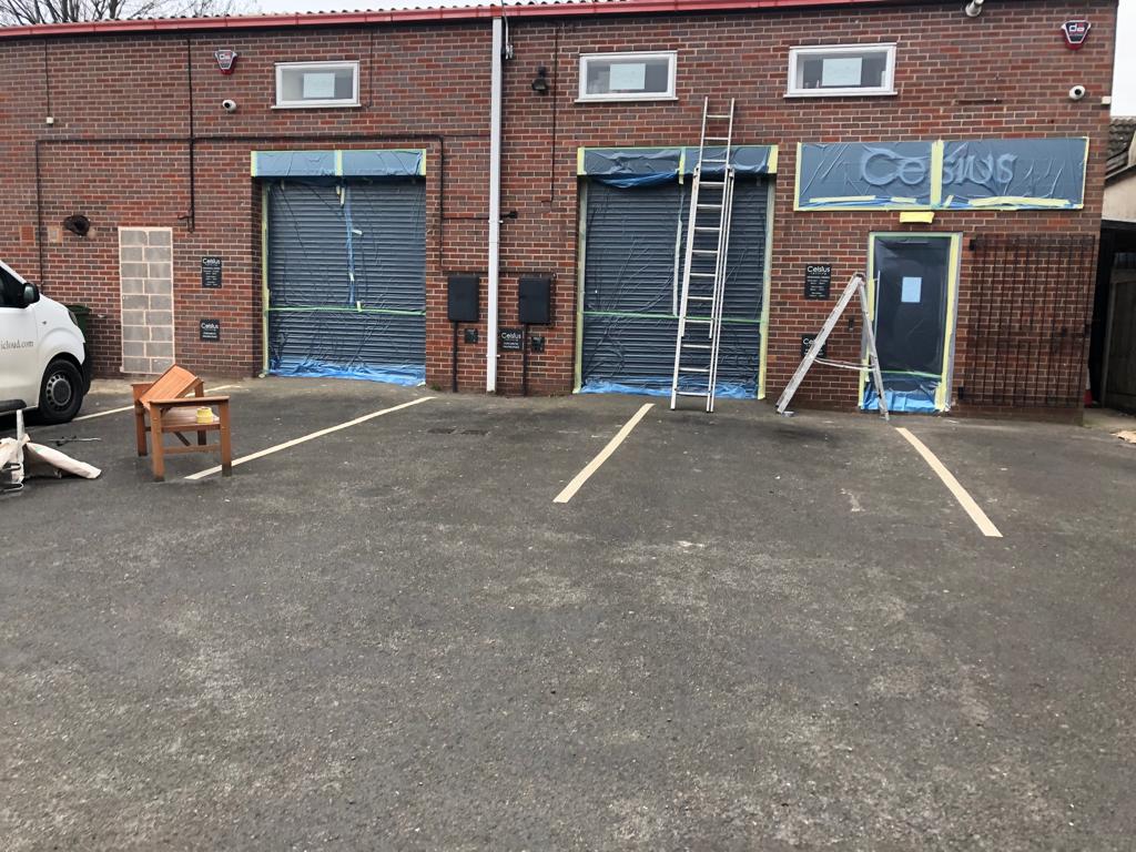 This is a photo of a commercial building being painted by painter and Decorator Leicester