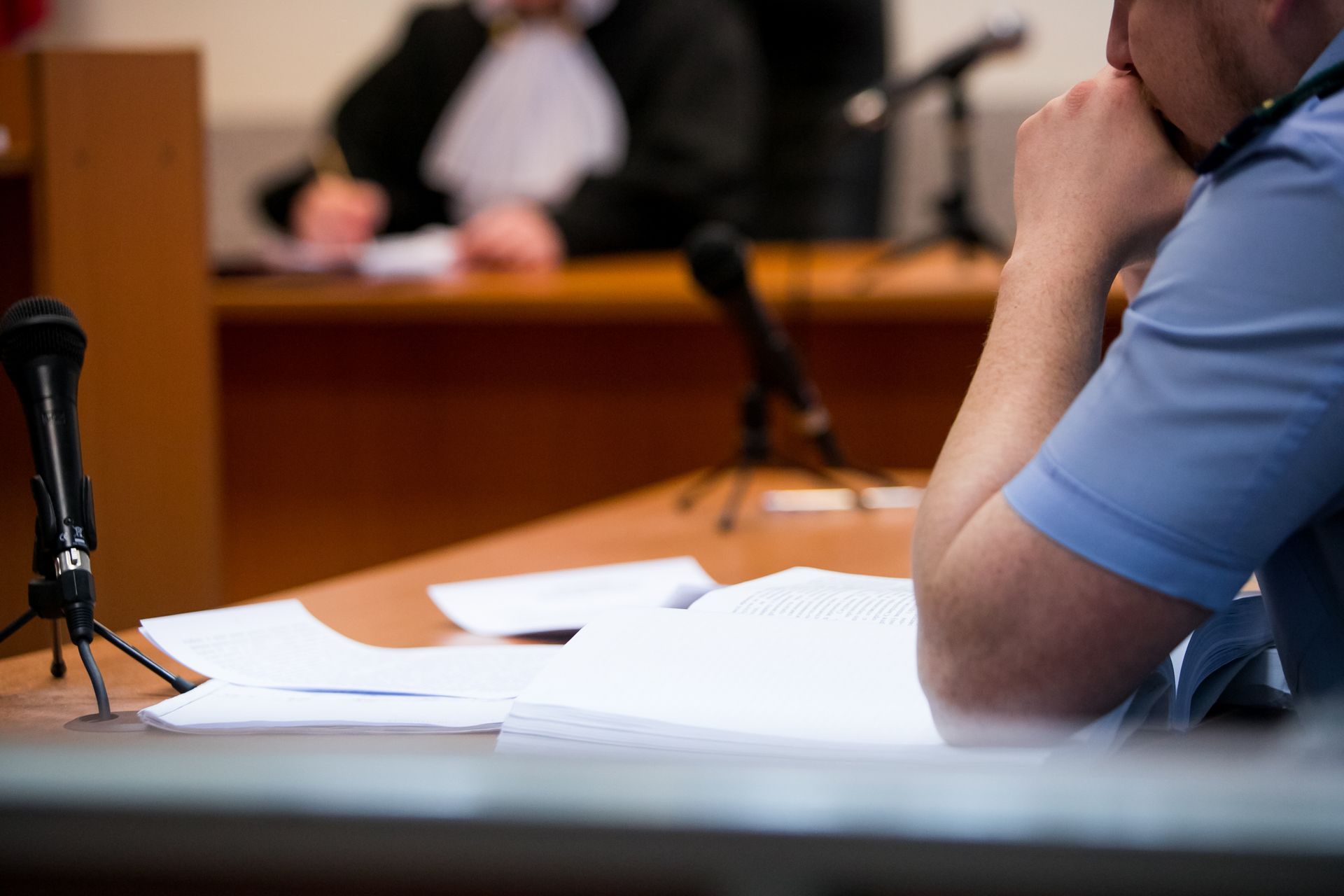 Lawyers listening to the judge in the court room.