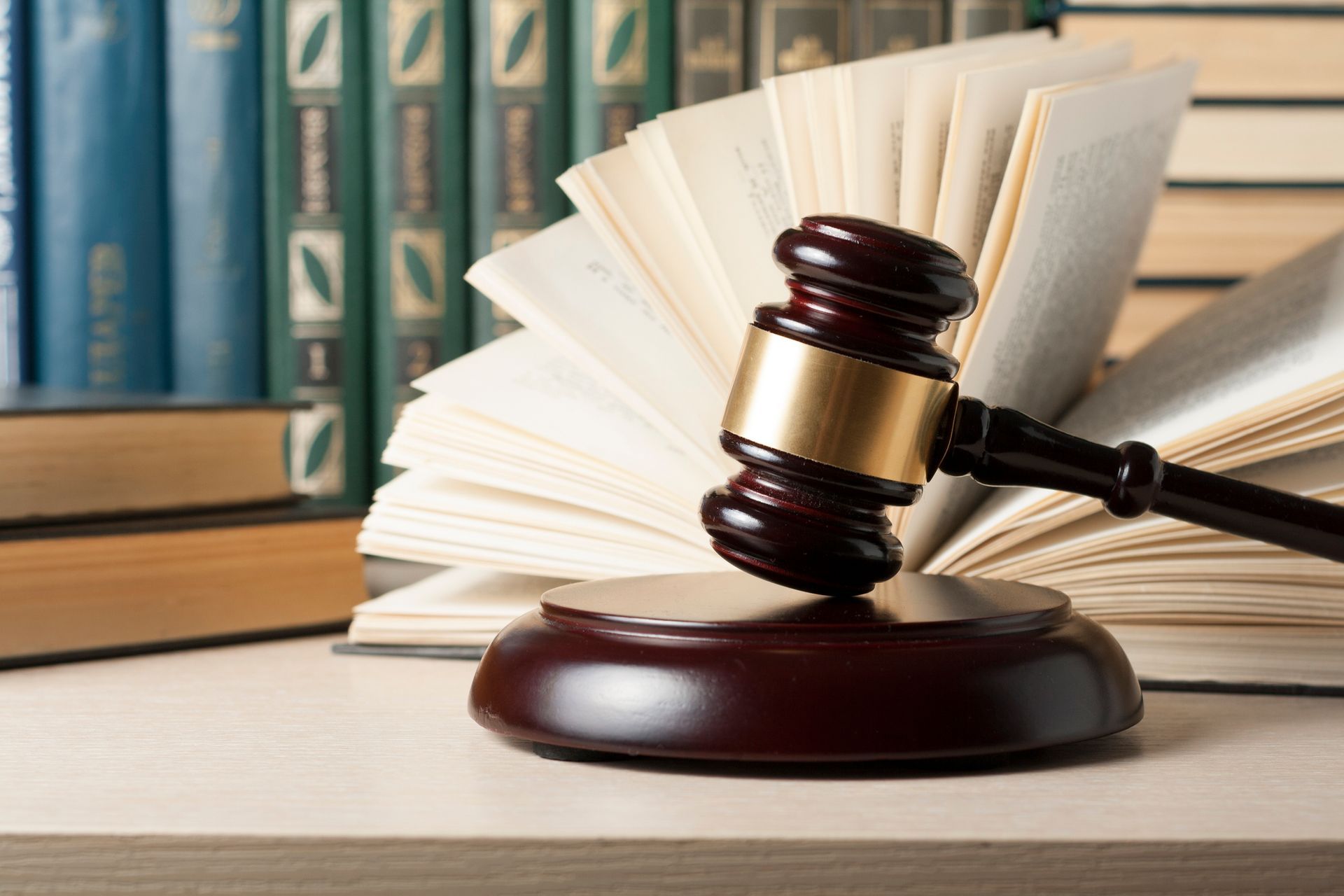 Judge’s gavel on sound block, showcasing professional family law lawyer services with legal books.