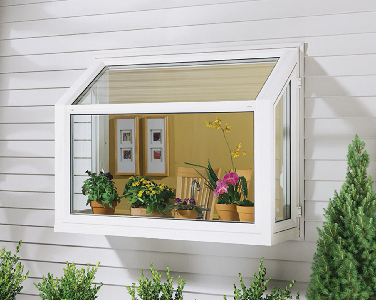 White house window box with potted flowers and a small open awning, viewed from outside