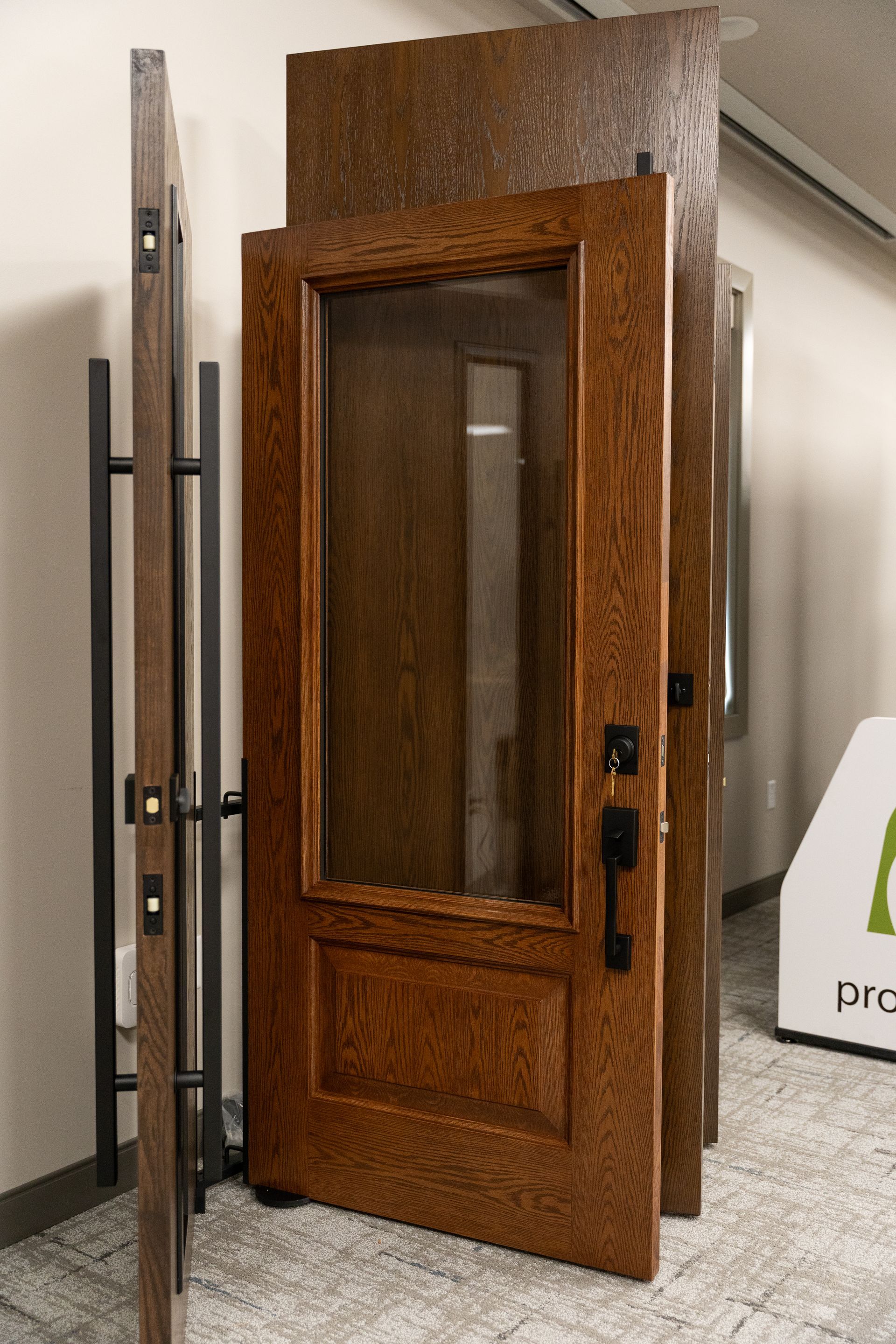 Wooden booth or small enclosure with an open door in an indoor showroom