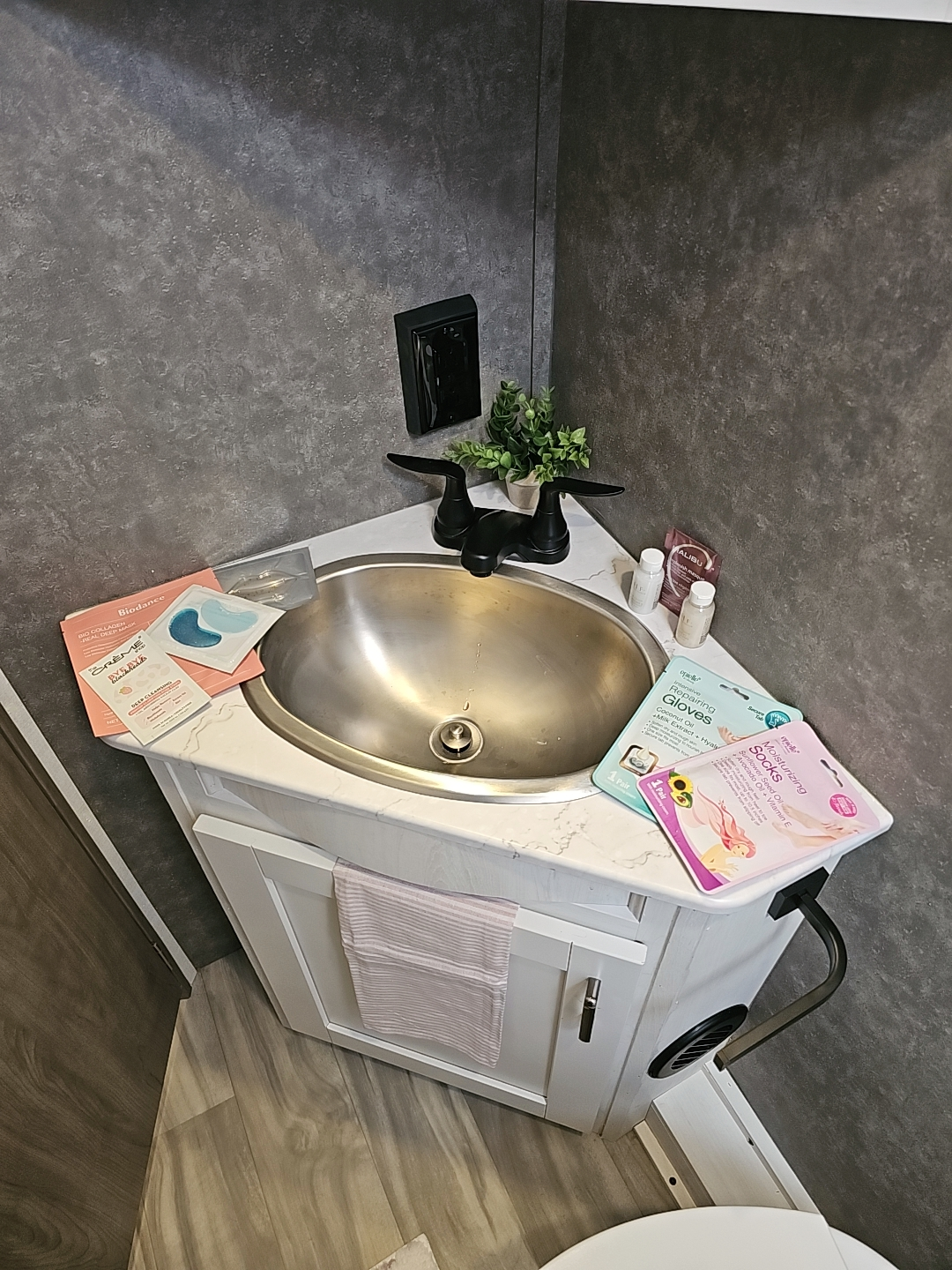 A bathroom in the RV that is modern