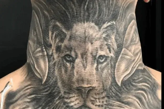 Lion head tattoo on a neck, black and gray shading, detailed fur, centered design.