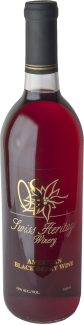 A bottle of Swiss Herbal Winery Black Currant Wine with a dark red liquid and gold label.