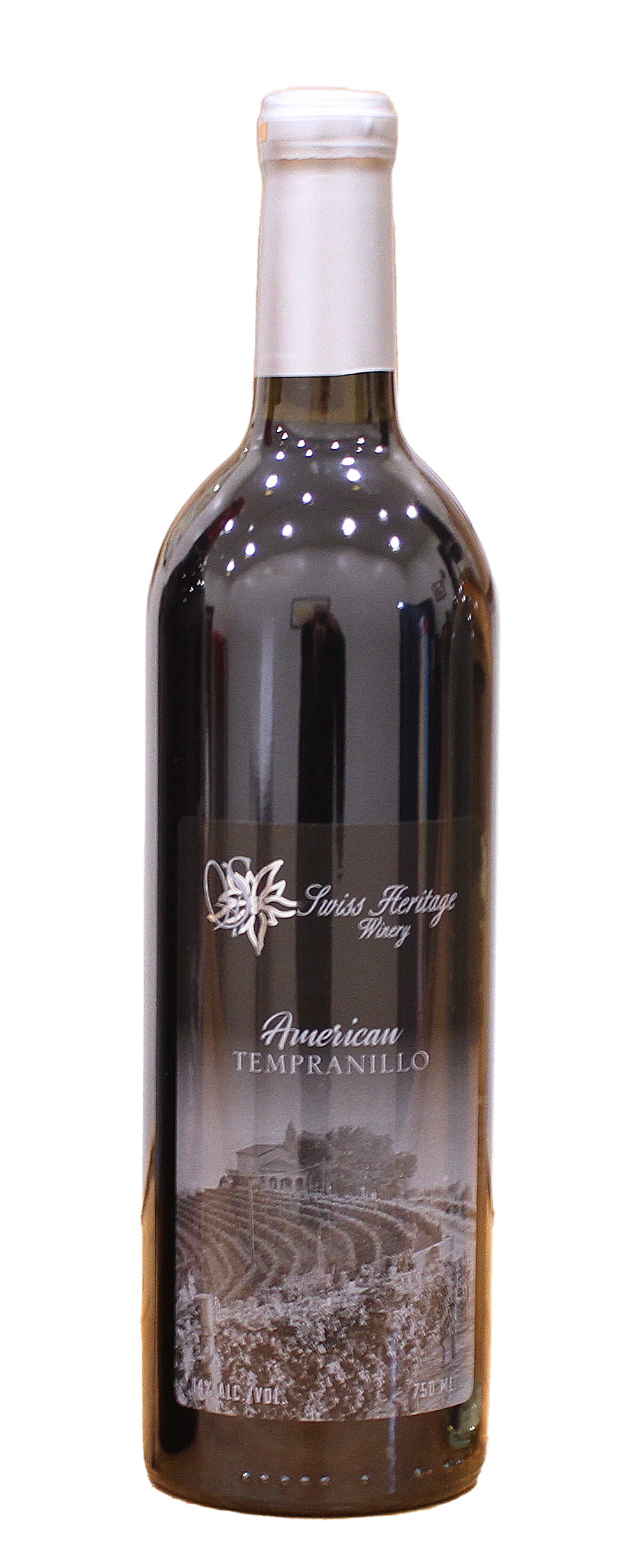 A bottle of dark red wine with a white label and silver foil.