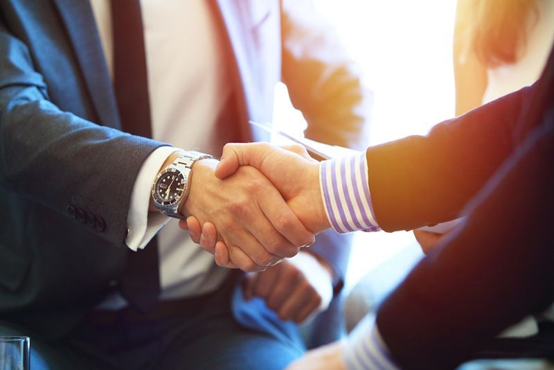 Lawyer and Client Shaking Hands — Mitchell Playford & Radburn Solicitors in Casino, NSW