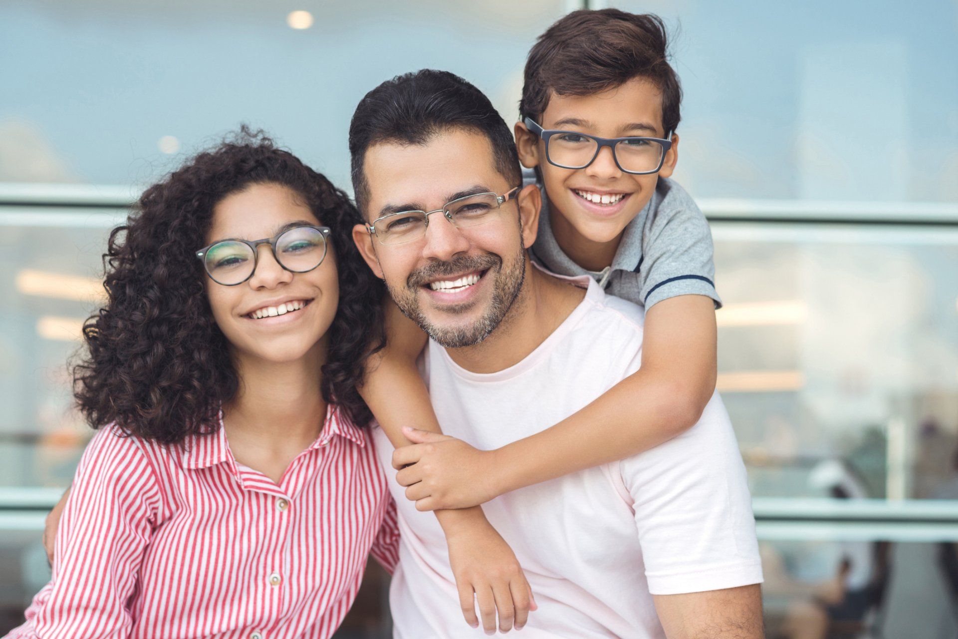 Family Smiling At Dental Clinic — Columbia, SC — University Dental PA Family Smiling At Dental Clinic — Columbia, SC — University Dental PA