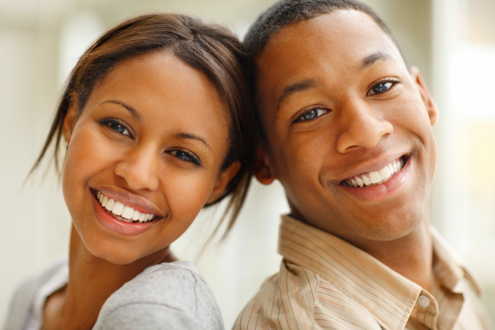 Family Smiling At Dental Clinic — Columbia, SC — University Dental PA Family Smiling At Dental Clinic — Columbia, SC — University Dental PA