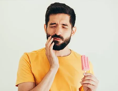 Man Have Sensitive Teeth With Ice — Columbia, SC — University Dental PA Man Have Sensitive Teeth With Ice — Columbia, SC — University Dental PA