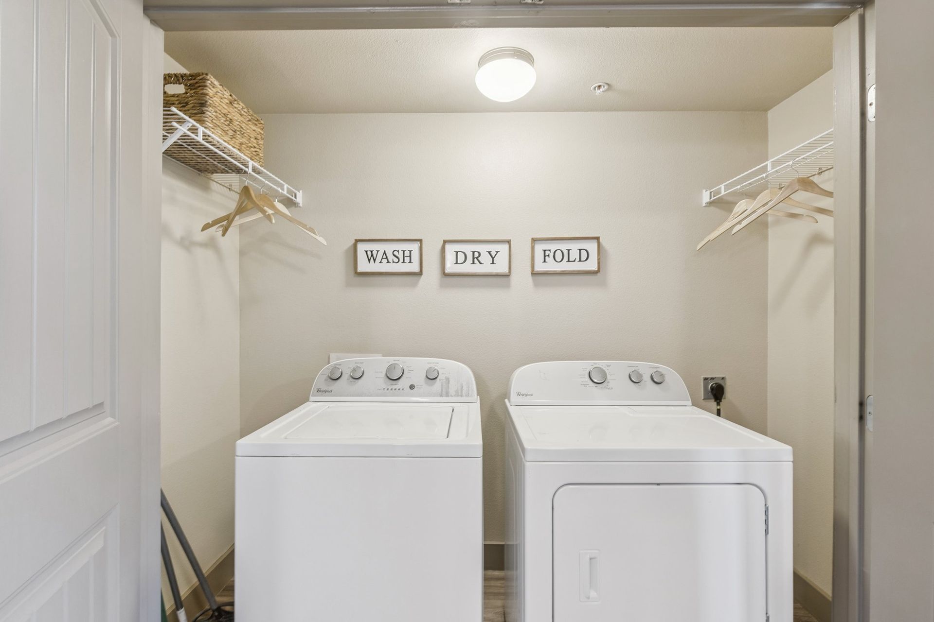 Laundry room with white washer and dryer,