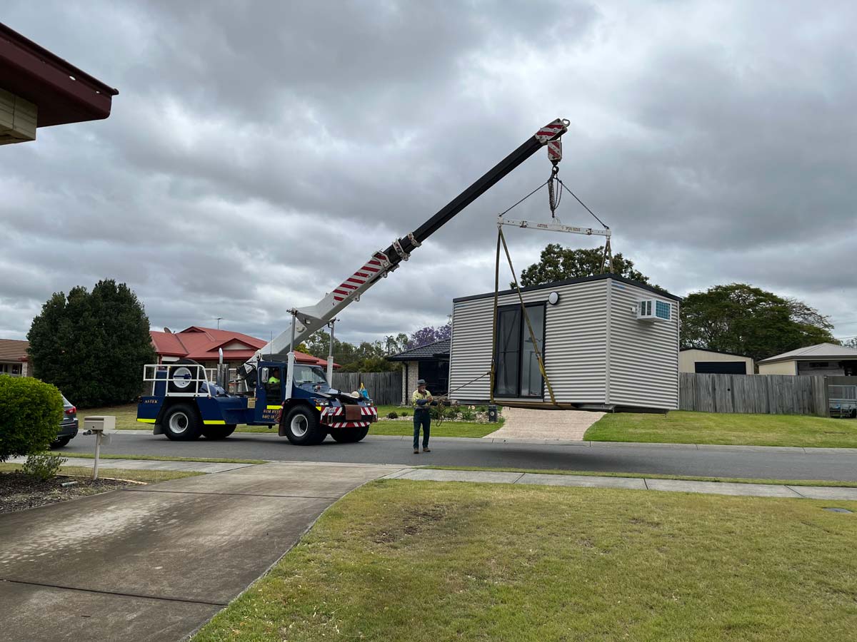 Truck Carrying a Cabin with Crane