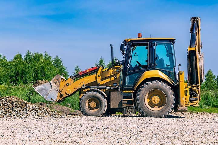 Heavy construction machinery working on land grading