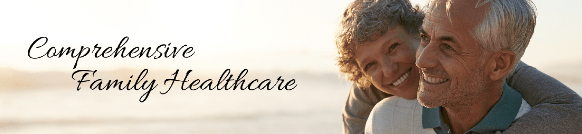 happy mature couple hugging on beach