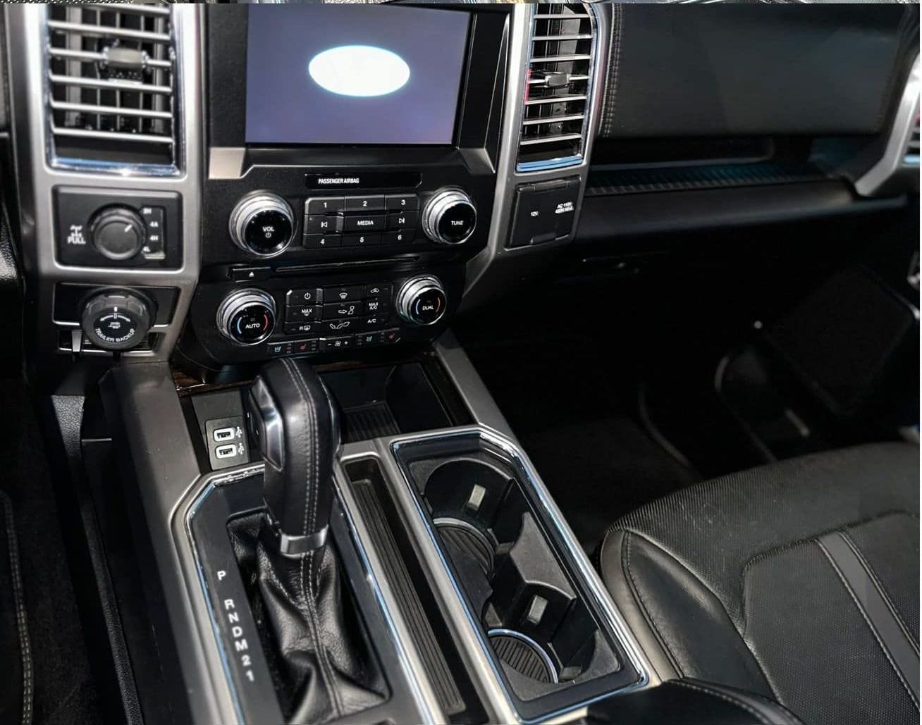 The interior of a ford truck with a touchscreen display