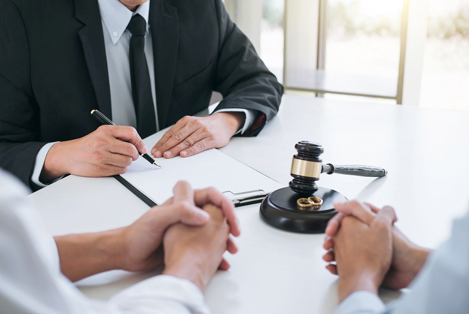 A couple is talking to a divorce attorney.