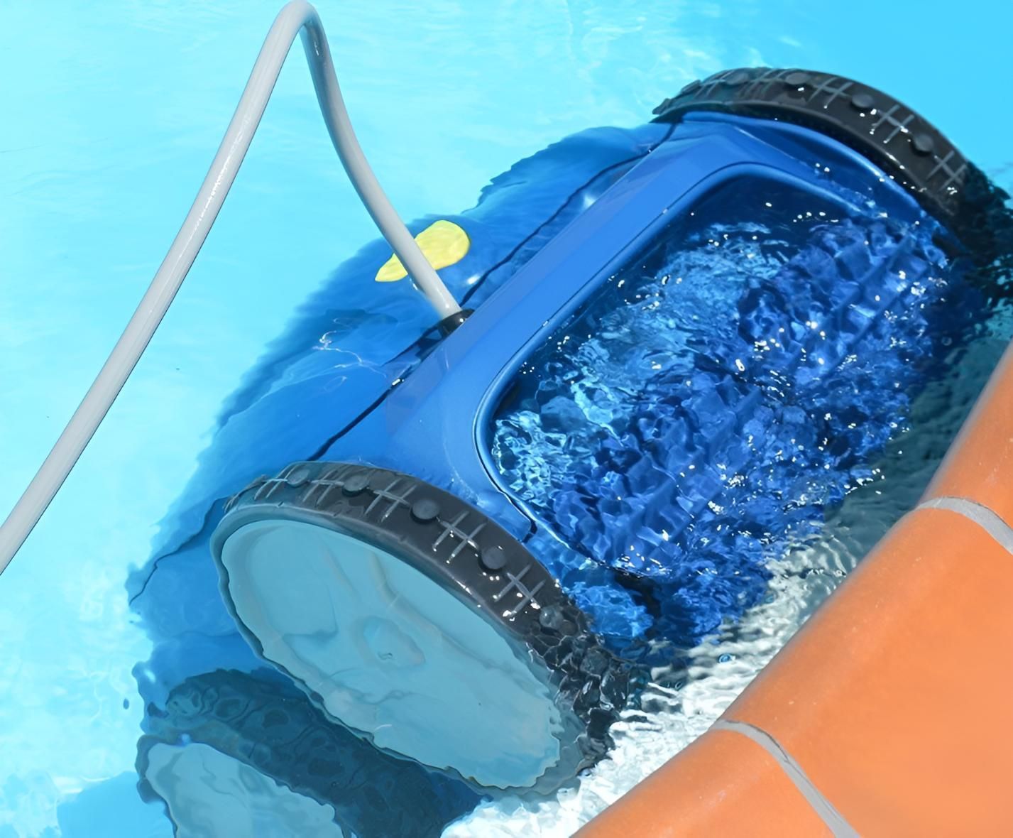A Blue Robotic Vacuum Cleaner Is In A Swimming Pool — Doug Allen Pools In Beaconsfield, QLD