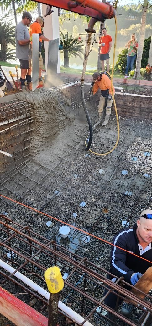 A Group Of People Are Working On A Construction Site — Doug Allen Pools In Beaconsfield, QLD