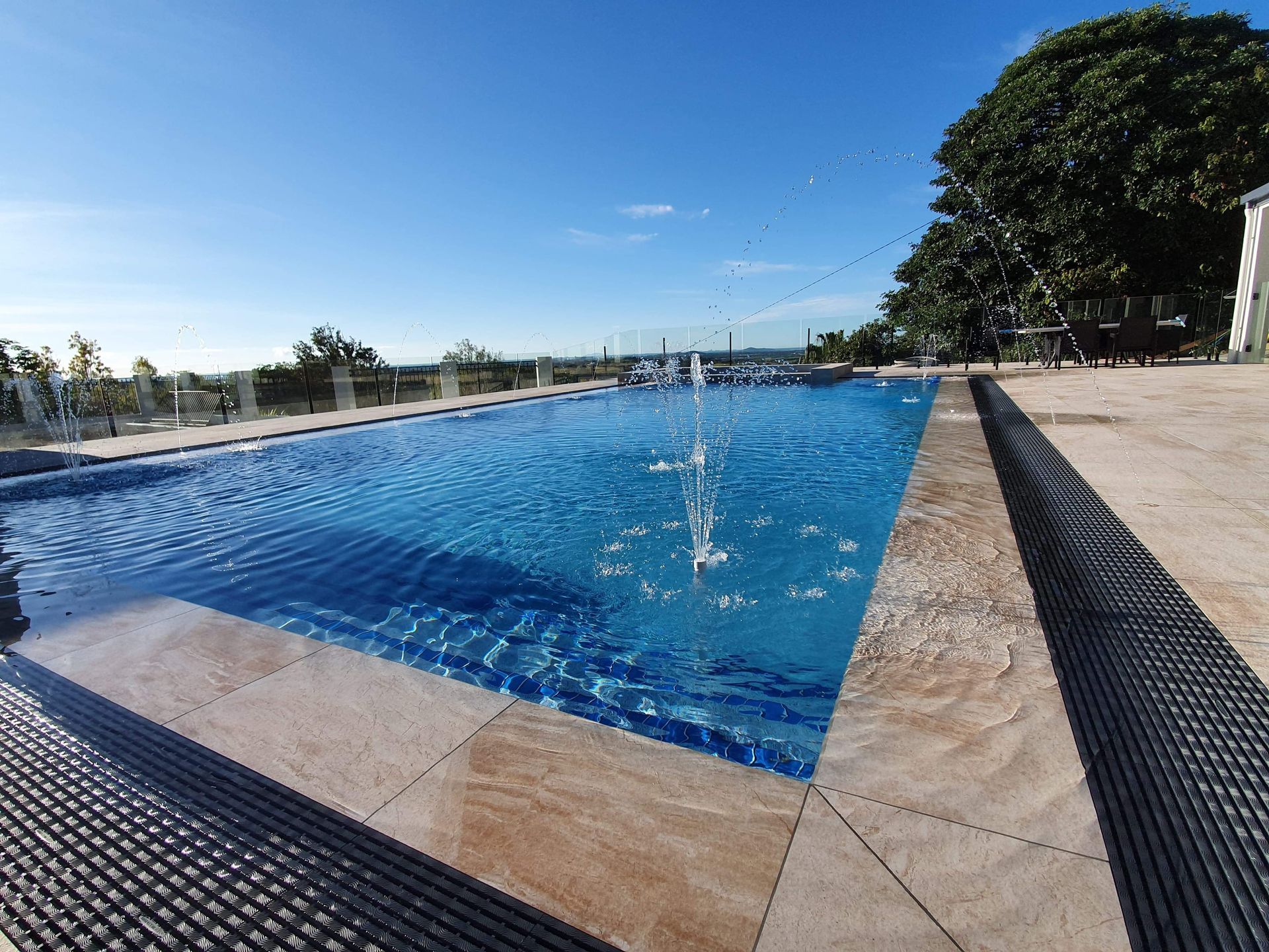 A Swimming Pool With Fountain  — Doug Allen Pools In Beaconsfield, QLD