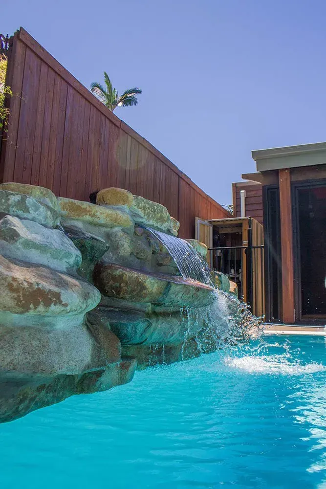 A Swimming Pool Rock Waterfall Feature — Doug Allen Pools In Beaconsfield, QLD