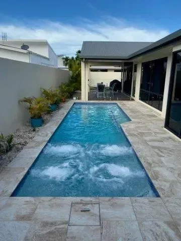 A Swimming Pool With Hot Tub In The Backyard — Doug Allen Pools In Beaconsfield, QLD