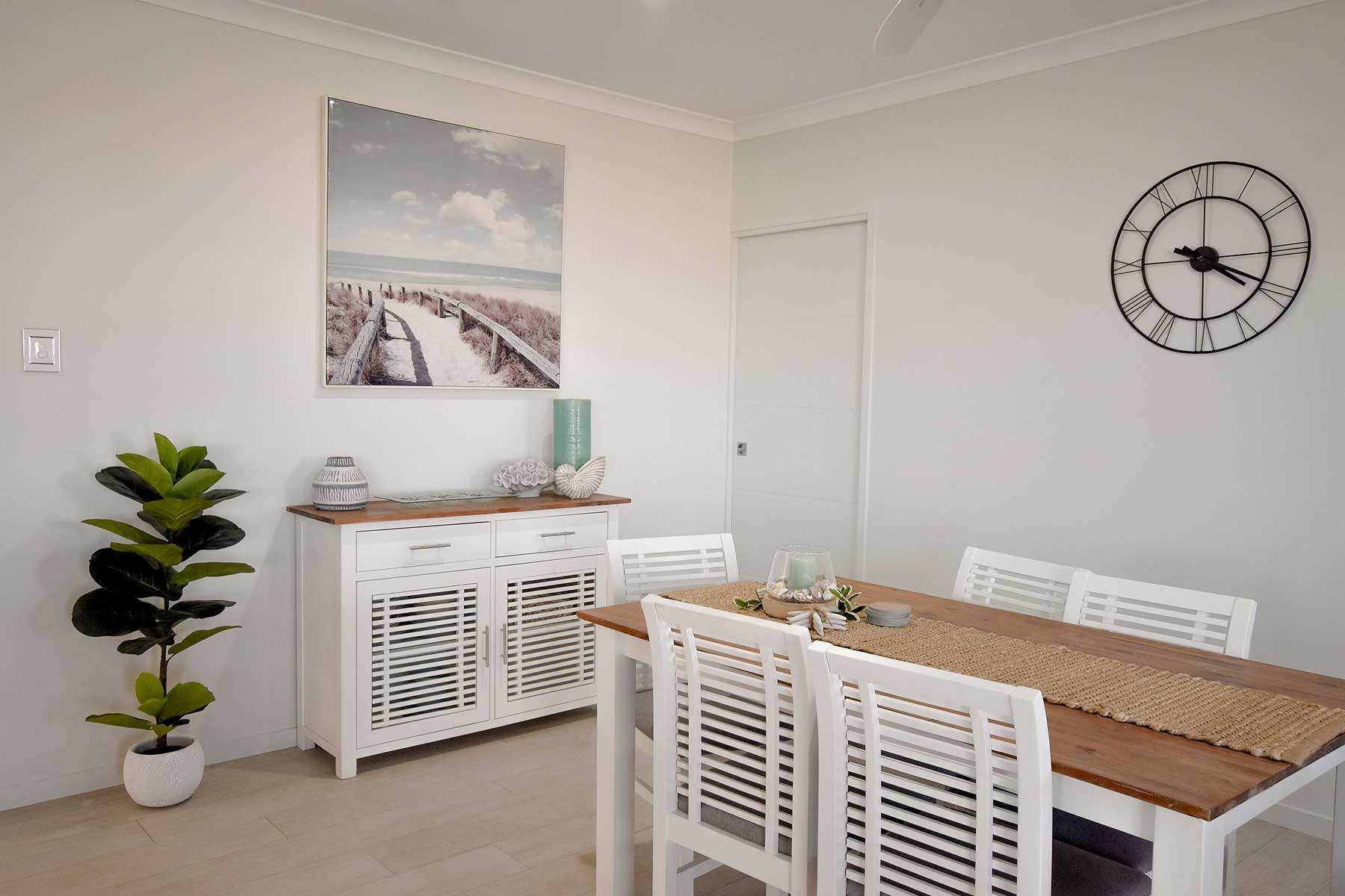 Bright Dining Room with White Chairs — Bundy Homes in Bundaberg North, QLD