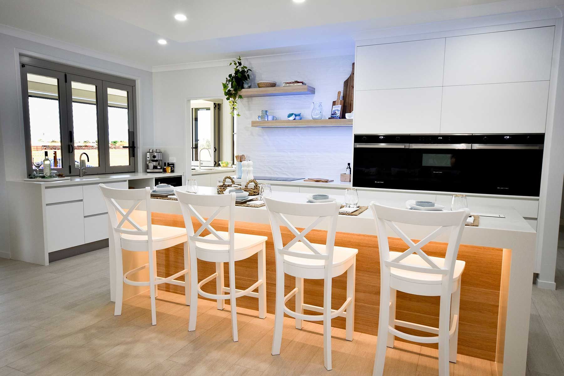 Bright Modern Kitchen with White Cabinets — Bundy Homes in Bundaberg North, QLD