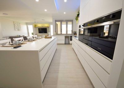Bright Modern White Kitchen with Built-In Oven — Bundy Homes in Bundaberg North, QLD