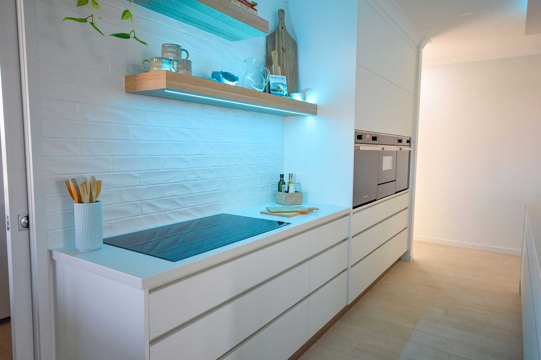 Modern White Kitchen with Long Countertop — Bundy Homes in Bundaberg North, QLD