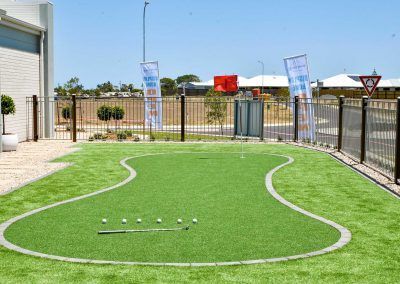 Small Fenced Turf Play Area with White Boundary Lines — Bundy Homes in Bundaberg North, QLD