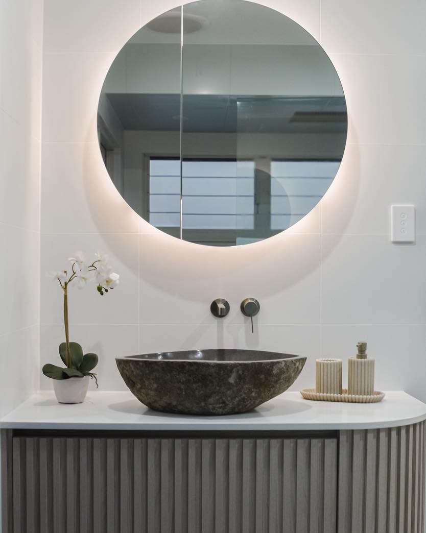Modern Bathroom Vanity with Round Backlit Mirror — Bundy Homes in Bundaberg North, QLD