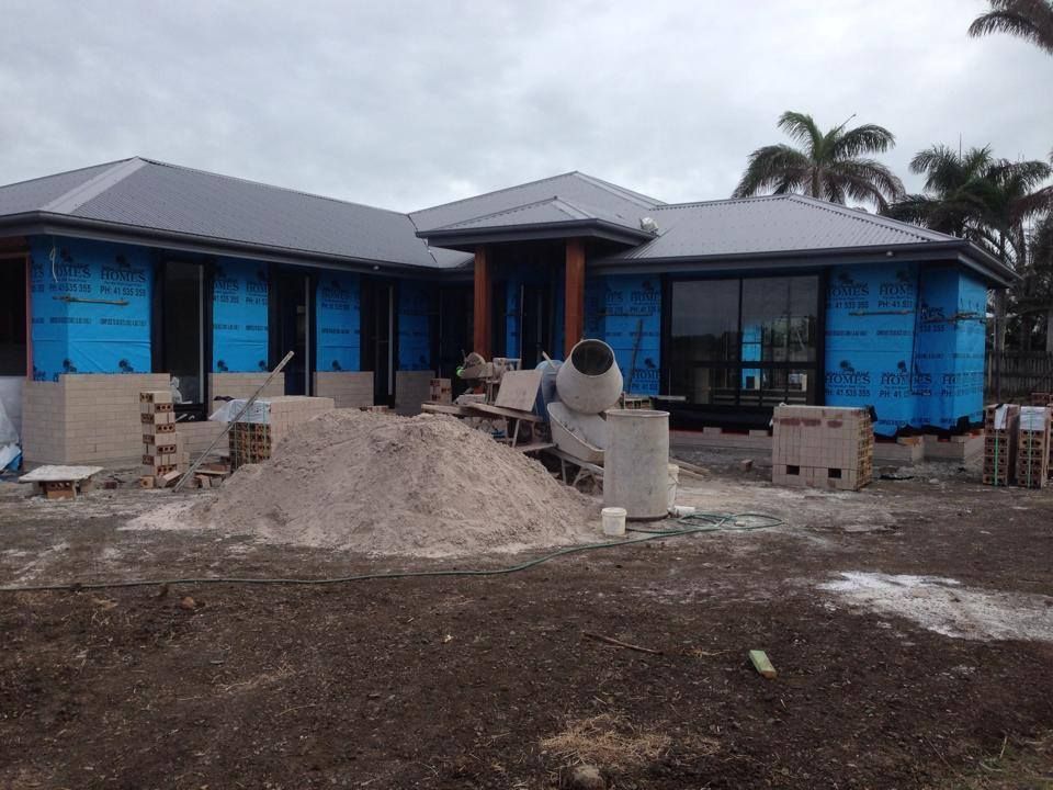 Partially Built House with Blue Wrap — Bundy Homes in Bundaberg North, QLD