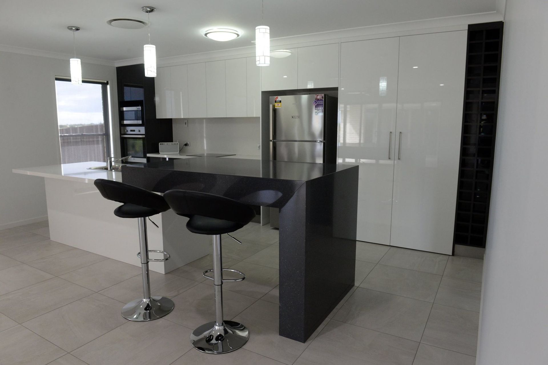 Modern Kitchen with White Cabinets — Bundy Homes in Bundaberg North, QLD