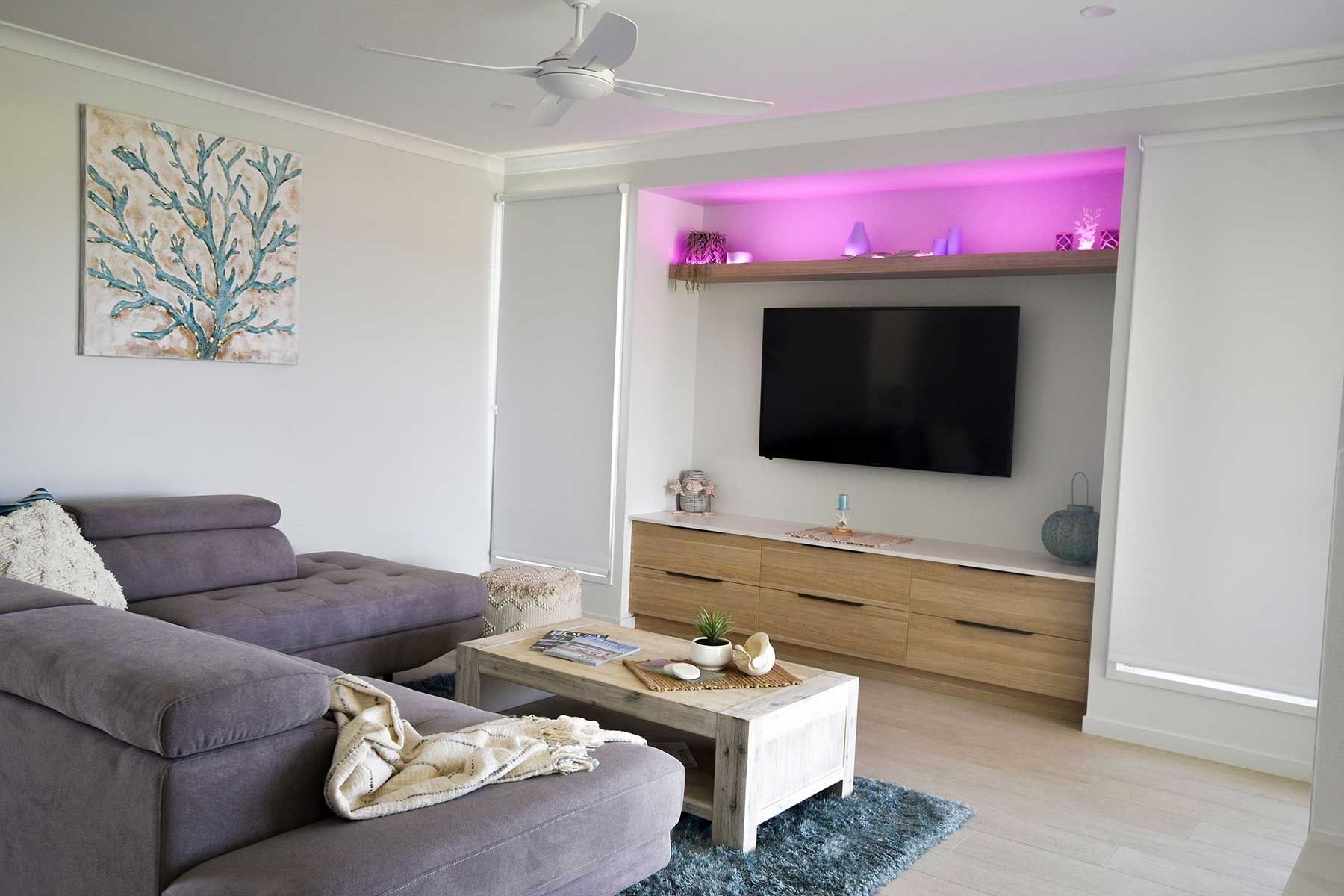 Modern Living Room with Gray Sectional — Bundy Homes in Bundaberg North, QLD