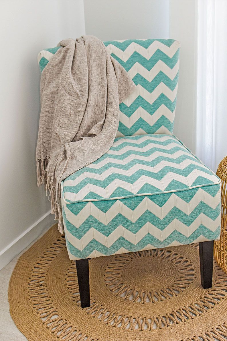 Mint and White Chevron Chair with A Beige Throw Draped — Bundy Homes in Bundaberg North, QLD